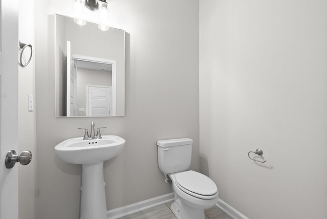 bathroom featuring sink and toilet