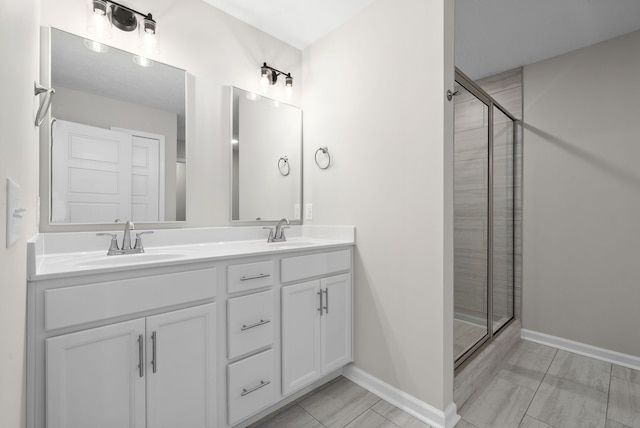 bathroom with vanity and an enclosed shower