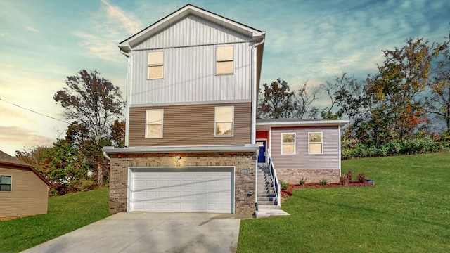 view of front facade with a garage and a lawn