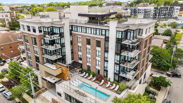 view of building exterior with a community pool