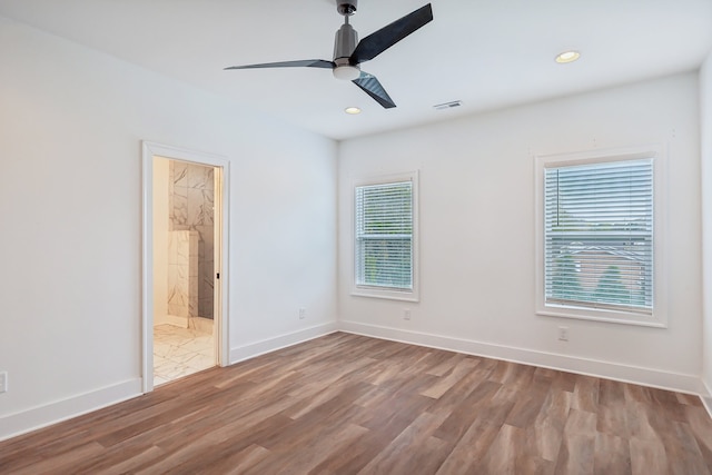 unfurnished room featuring light hardwood / wood-style floors and ceiling fan