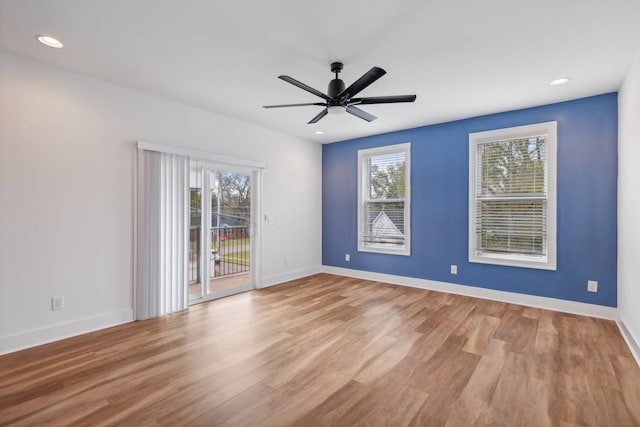 unfurnished room with ceiling fan and light hardwood / wood-style flooring