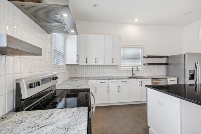 kitchen with a wealth of natural light, sink, appliances with stainless steel finishes, and white cabinetry