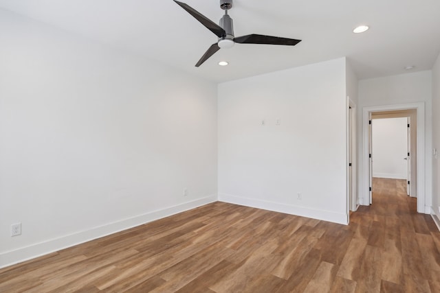 unfurnished room with ceiling fan and hardwood / wood-style floors