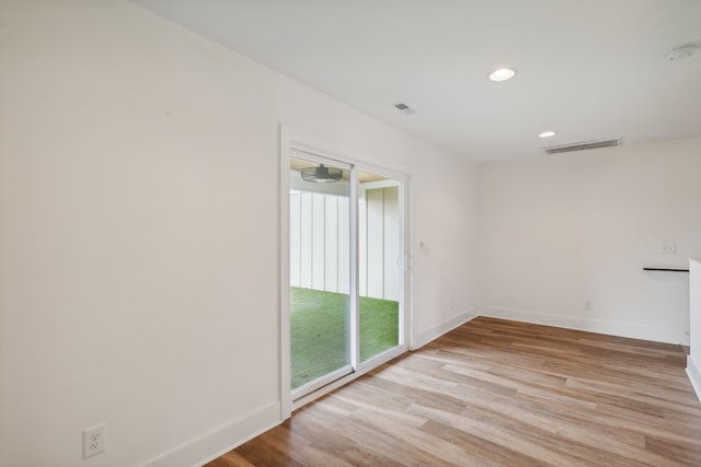 spare room with light wood-type flooring