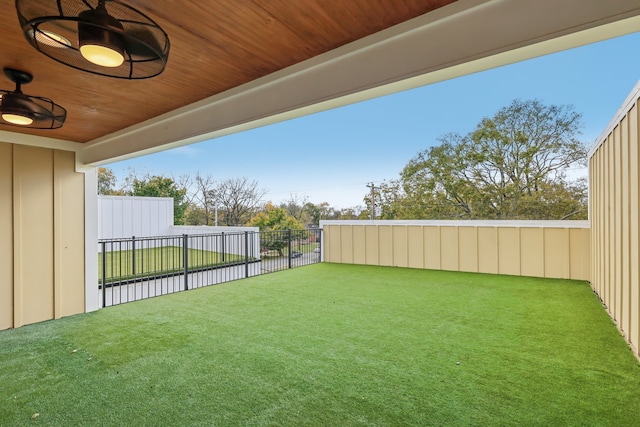 view of yard with ceiling fan