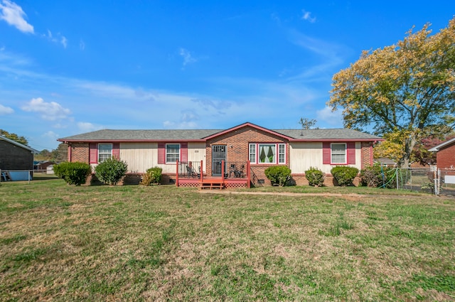 single story home featuring a front yard