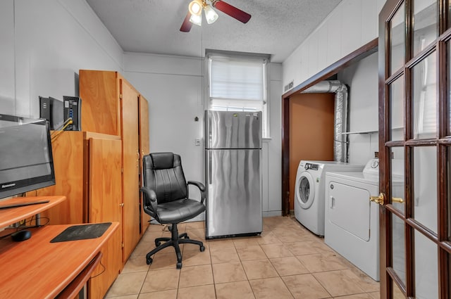 tiled home office featuring washing machine and clothes dryer, a textured ceiling, and ceiling fan