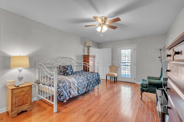 bedroom featuring light hardwood / wood-style flooring, access to outside, and ceiling fan