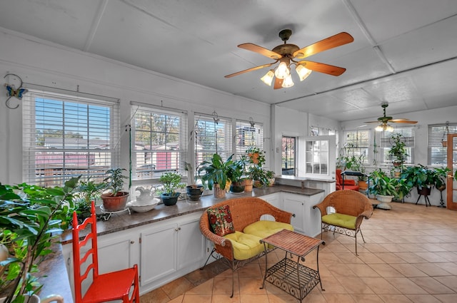 sunroom with ceiling fan