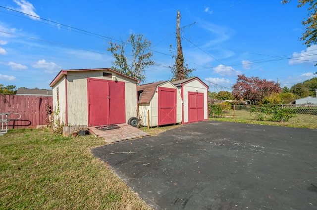 view of outbuilding with a yard