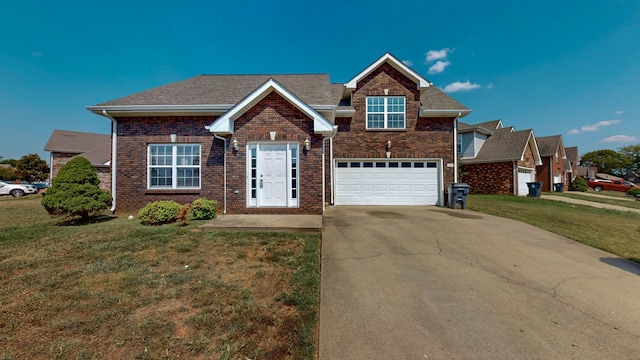 view of front facade with a garage and a front lawn