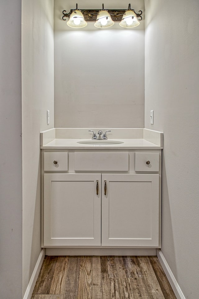 bathroom with vanity and wood-type flooring