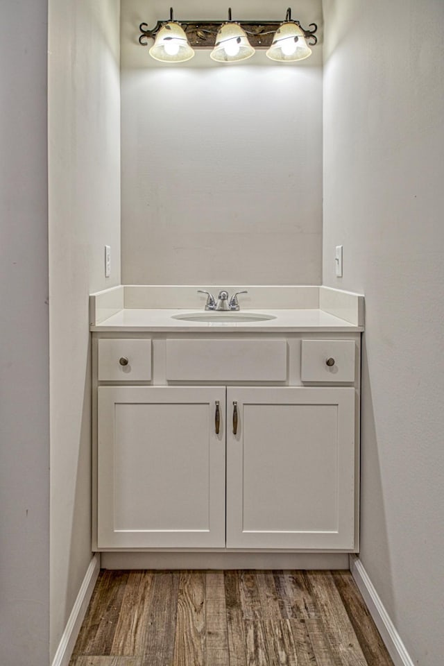 10309 Goff Ridge Rd, Baxter, TN 38544 - bathroom featuring wood finished floors, vanity, and baseboards