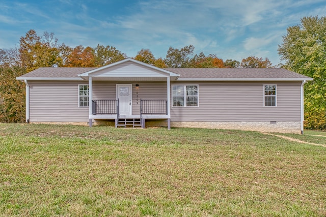 view of front of property featuring a front yard and a wooden deck