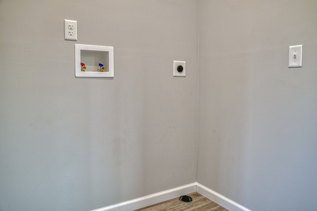 laundry area with washer hookup, electric dryer hookup, and wood-type flooring