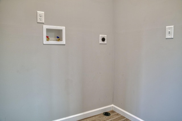 10309 Goff Ridge Rd, Baxter, TN 38544 - laundry area featuring electric dryer hookup, baseboards, wood finished floors, and washer hookup