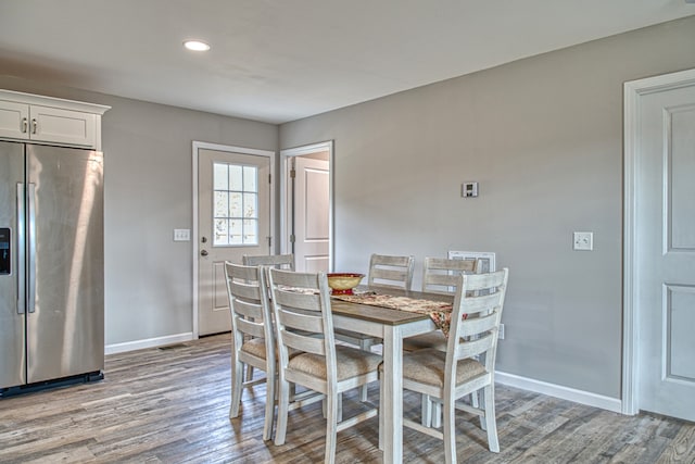 dining space featuring light wood-type flooring