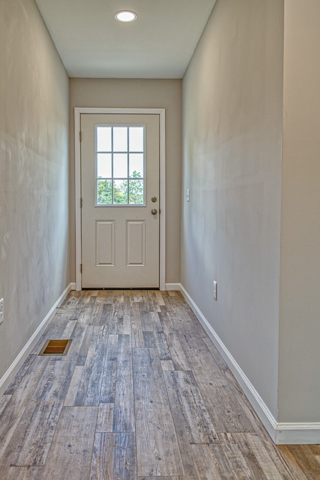 entryway with light hardwood / wood-style flooring