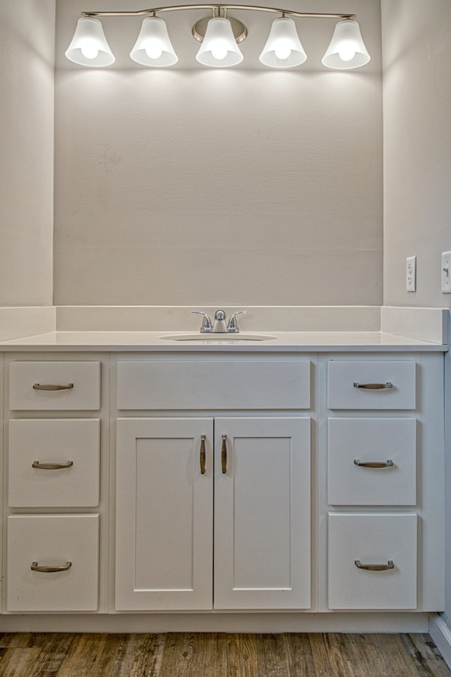 bathroom with vanity and hardwood / wood-style flooring