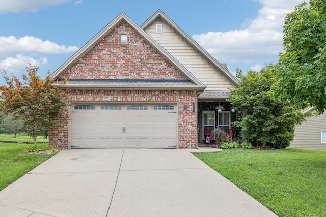 view of front of home featuring a garage and a front lawn