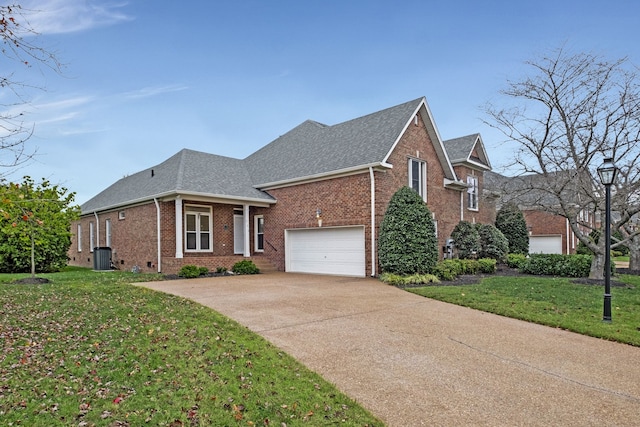 view of front of house with a front lawn and a garage