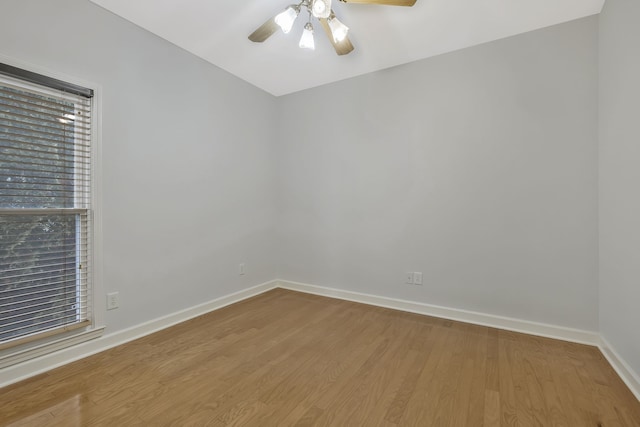 empty room featuring hardwood / wood-style flooring and ceiling fan