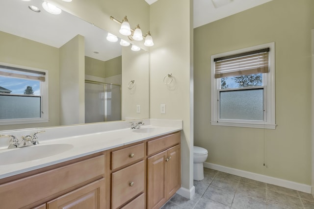 bathroom featuring toilet, vanity, an enclosed shower, and tile patterned flooring