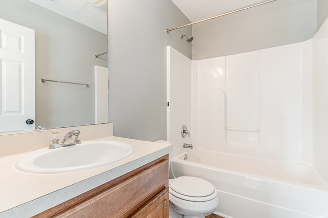 full bathroom with toilet, shower / washtub combination, a textured ceiling, and vanity