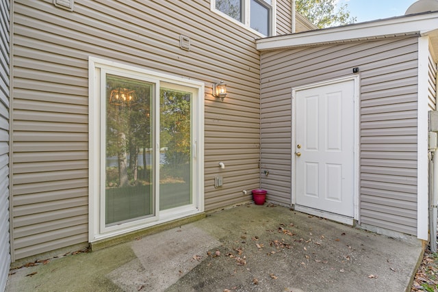 entrance to property with a patio area