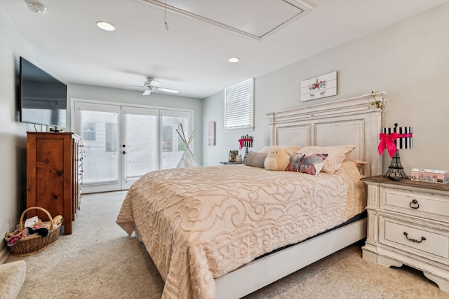 bedroom featuring access to outside, light colored carpet, and ceiling fan