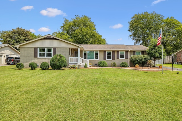 ranch-style house featuring a porch and a front yard