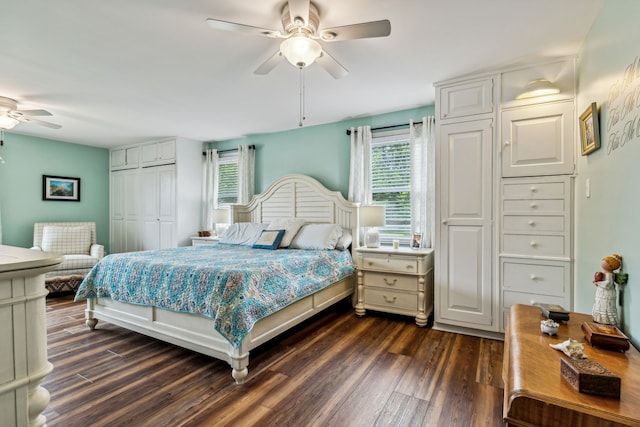 bedroom with dark hardwood / wood-style flooring, a closet, and ceiling fan