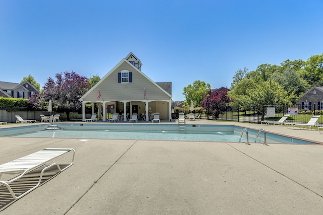 view of swimming pool with a patio