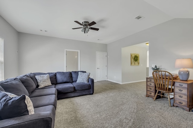 living room featuring ceiling fan, carpet, and vaulted ceiling