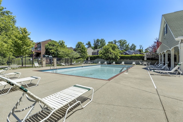 view of swimming pool with a patio