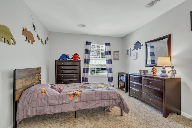 bedroom featuring light carpet