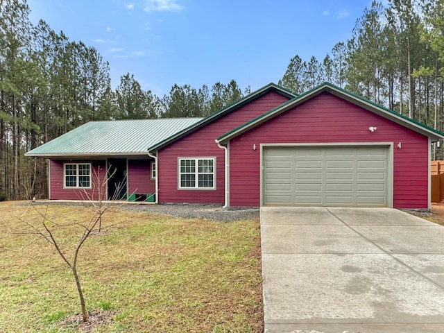 ranch-style home with a front lawn and a garage