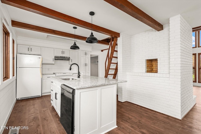 kitchen with black dishwasher, hanging light fixtures, light stone counters, sink, and white refrigerator