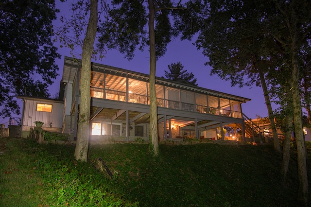 rear view of house with a lawn