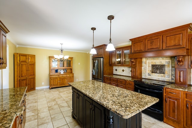 kitchen featuring decorative backsplash, hanging light fixtures, a kitchen island, black range oven, and stainless steel refrigerator with ice dispenser