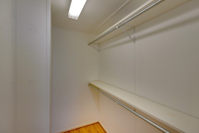 walk in closet featuring hardwood / wood-style floors