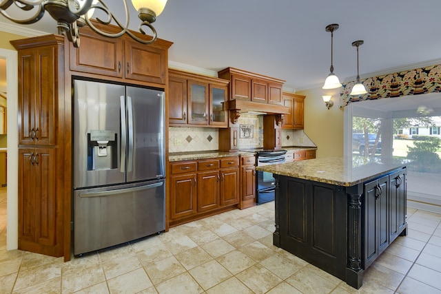 kitchen featuring electric range, a kitchen island, backsplash, stainless steel fridge with ice dispenser, and light stone countertops