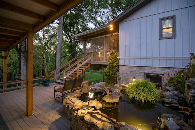 wooden terrace featuring a sunroom