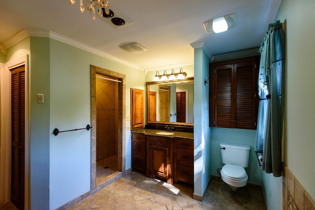 bathroom with vanity, crown molding, toilet, and walk in shower