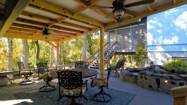 view of patio / terrace with a sunroom and ceiling fan