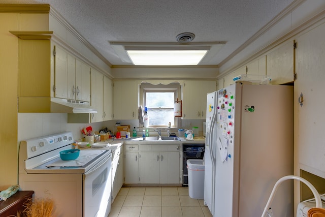 kitchen featuring sink, a textured ceiling, white appliances, and light tile patterned floors