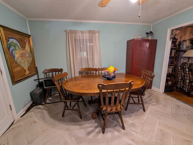 dining space featuring ceiling fan and ornamental molding