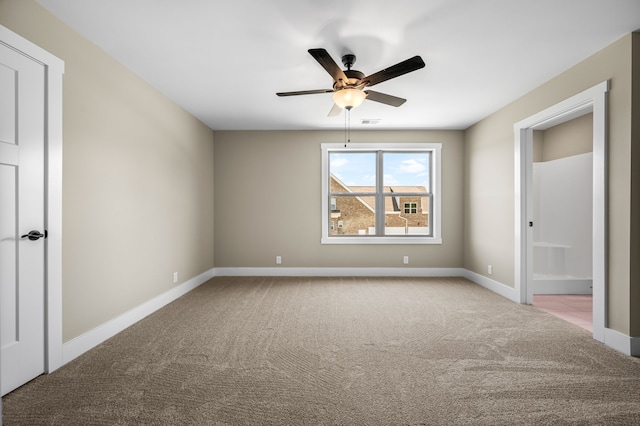 unfurnished bedroom featuring light colored carpet and ceiling fan