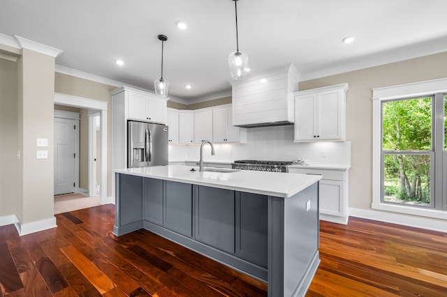 kitchen with custom exhaust hood, stainless steel fridge, white cabinets, and dark hardwood / wood-style floors